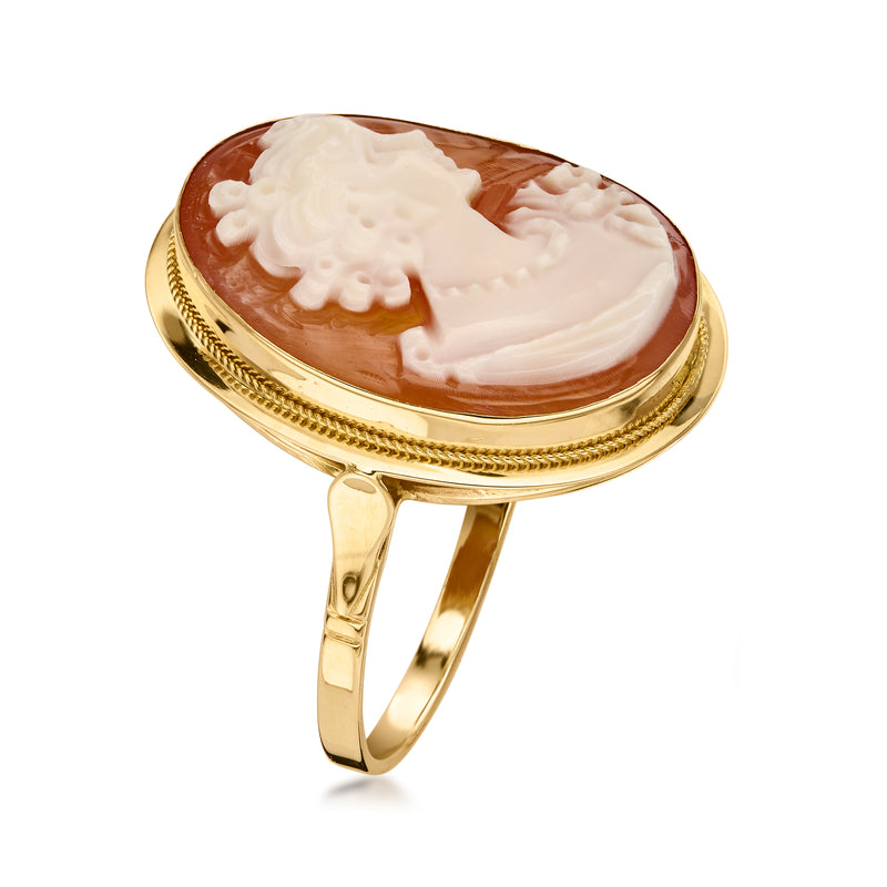 Oval brown shell cameo ring with white figure, gold bezel and tapered band