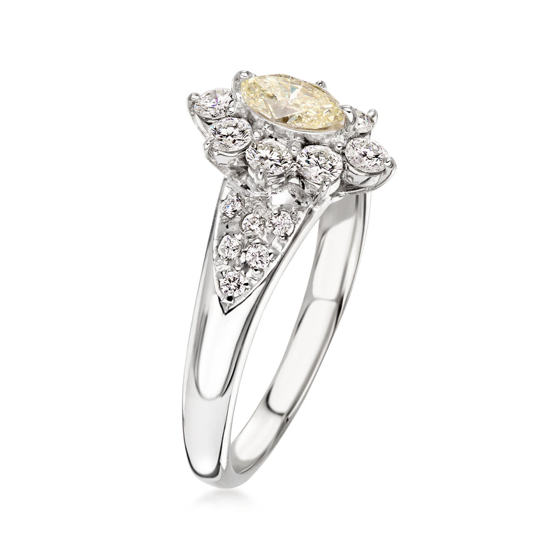 C. 2000 Vintage .45 Carat Yellow Diamond Ring with .70 ct. t.w. White Diamonds in Platinum. Size 8