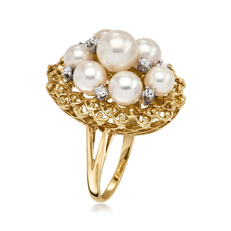 14kt yellow gold pearl and diamond cluster ring, rounded band with raised setting.