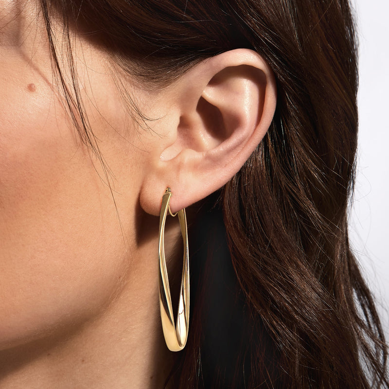 C. 1990 Vintage 14kt Yellow Gold Oval Hoop Earrings. 1 3/16"