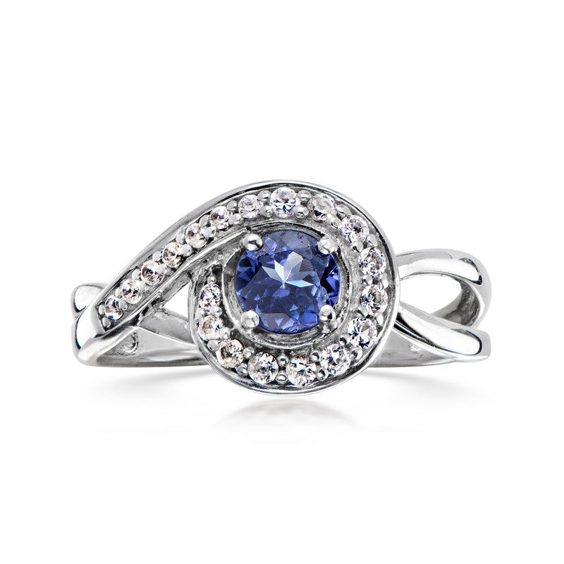 C. 1980 Vintage .45 Carat Tanzanite Swirl Ring with .30 ct. t.w. Synthetic White Spinel in Sterling Silver. Size 7