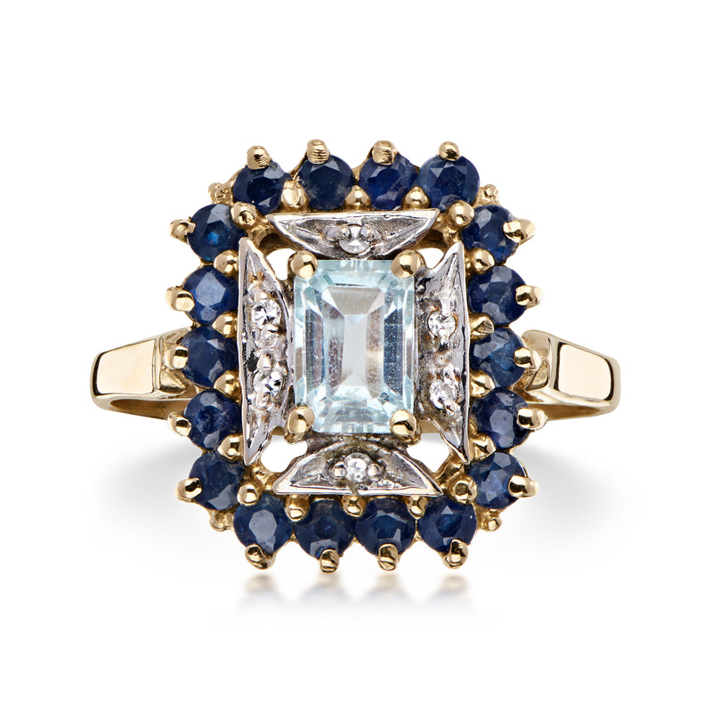 C. 1980 Vintage .75 Carat Sky Blue Topaz and .90 ct. t.w. Sapphire Ring with Diamonds in 14kt Yellow Gold. Size 7