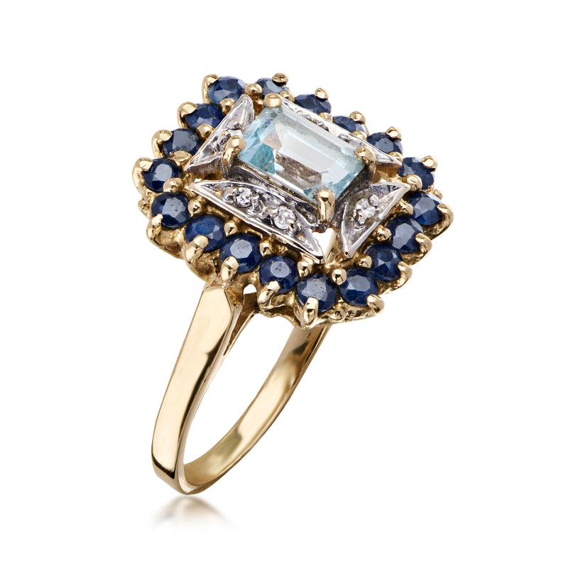 C. 1980 Vintage .75 Carat Sky Blue Topaz and .90 ct. t.w. Sapphire Ring with Diamonds in 14kt Yellow Gold. Size 7