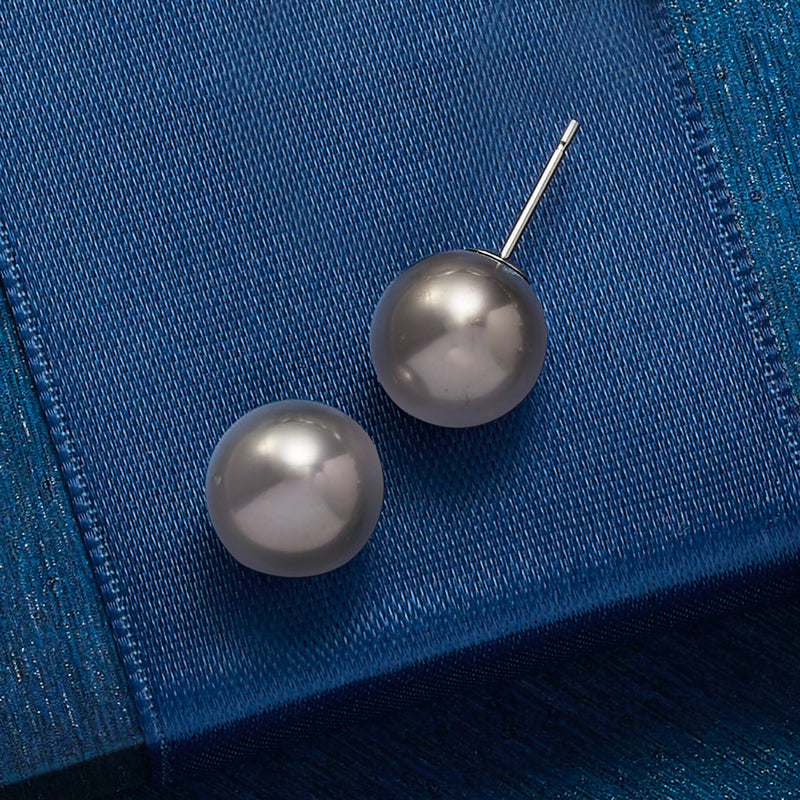 Round black cultured pearl stud earrings with visible white-gold posts, pair view