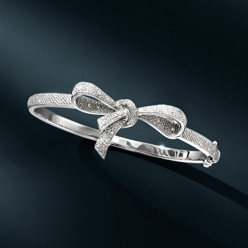 Sterling silver diamond bow bangle bracelet with pavé details