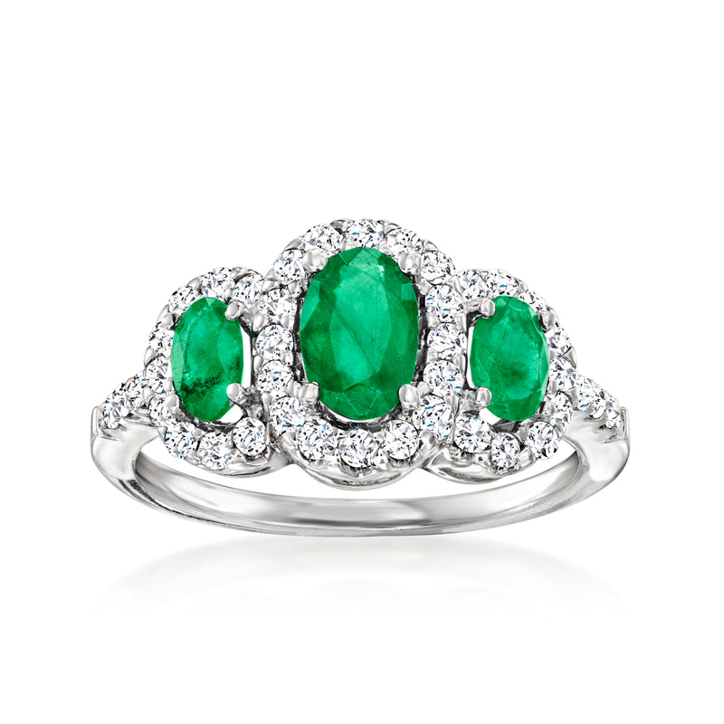 14k white gold three-stone ring with oval green center emerald and diamond accents