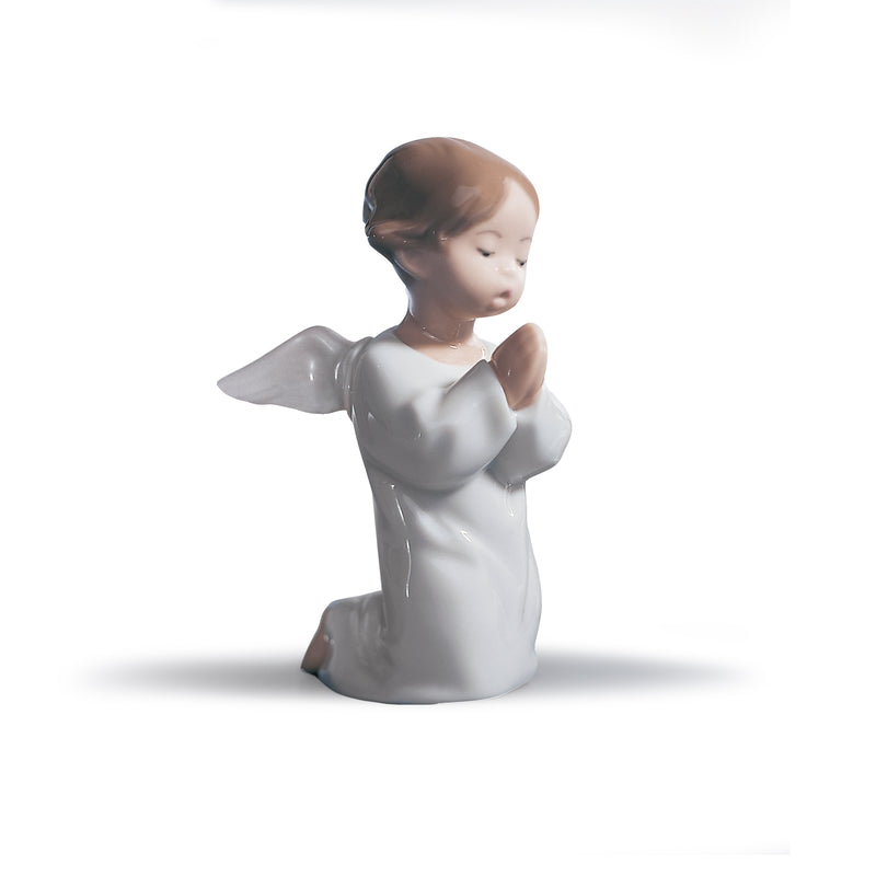 Lladro praying angel porcelain figurine, white with clasped hands and wings.
