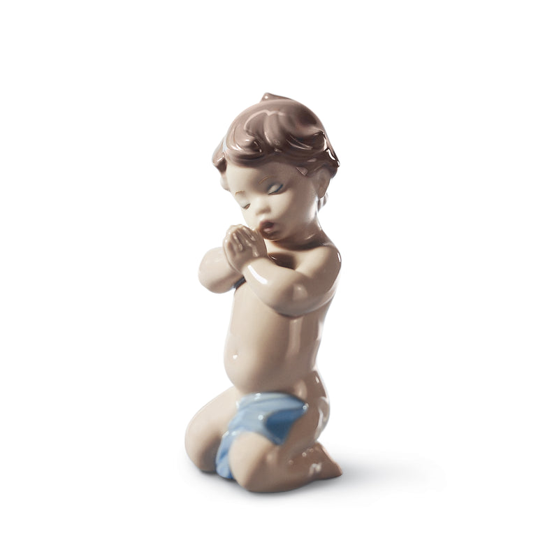 Lladro porcelain figurine of a kneeling praying child with blue robe