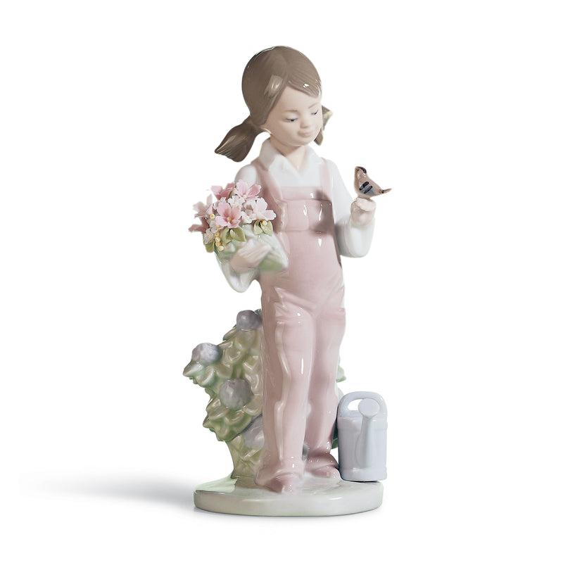 Lladro Spring porcelain figurine of a girl holding pink flowers and a small bird