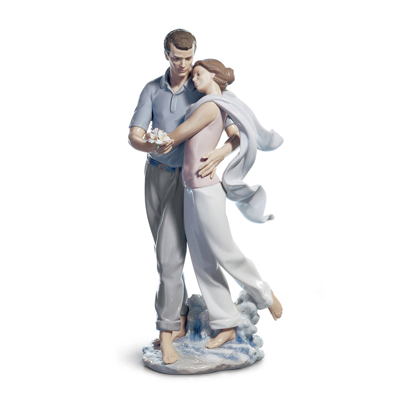 Lladro porcelain figurine of a man and woman embracing, man holding flowers