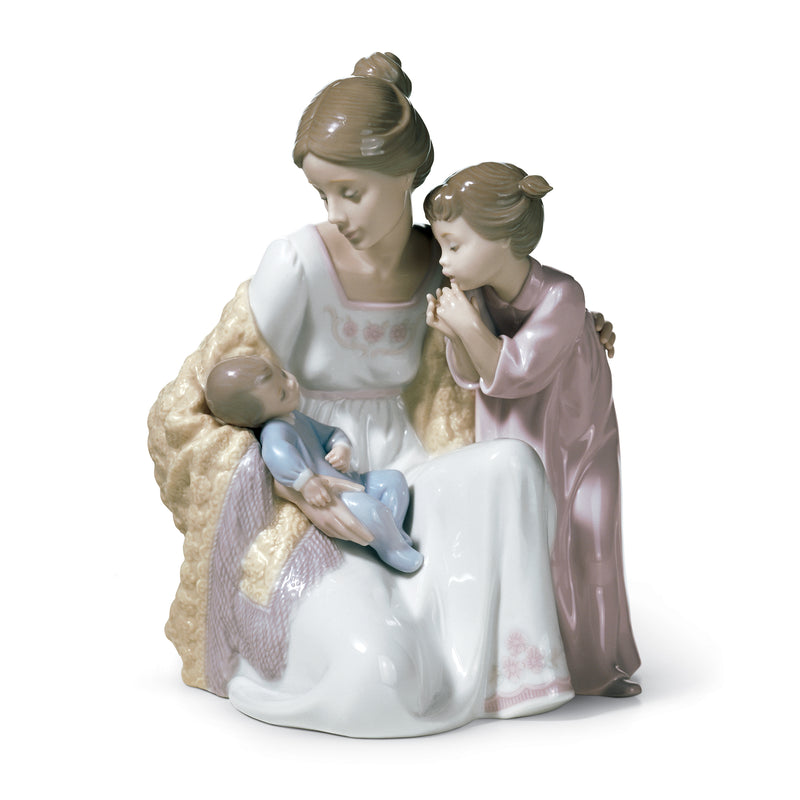 Lladro porcelain figurine of a woman holding a baby, with a standing child beside her