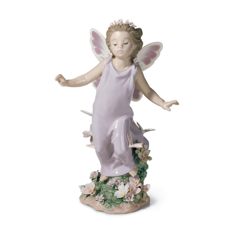 Porcelain figurine of a child fairy in a lilac dress with butterfly wings and floral base