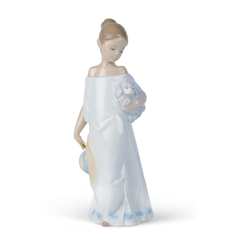 Nao porcelain figurine of a woman holding a blue animal