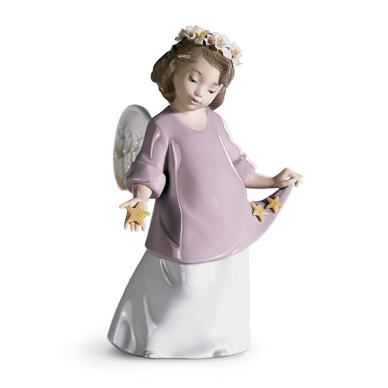 Lladro porcelain angel figurine in lilac dress with gold star accents, kneeling pose