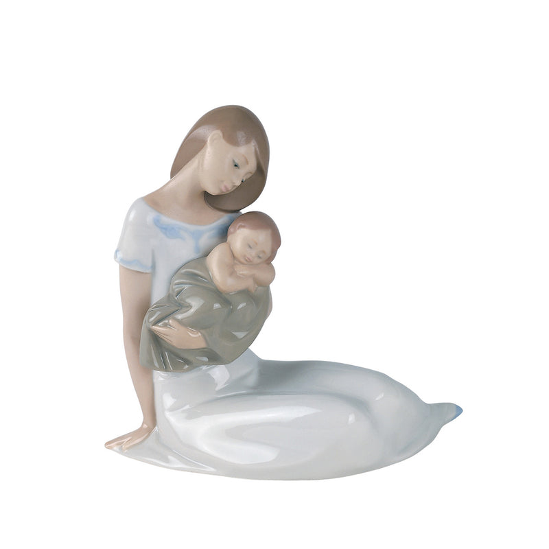 Nao porcelain figurine of a mother holding a baby, light blue and pale white.