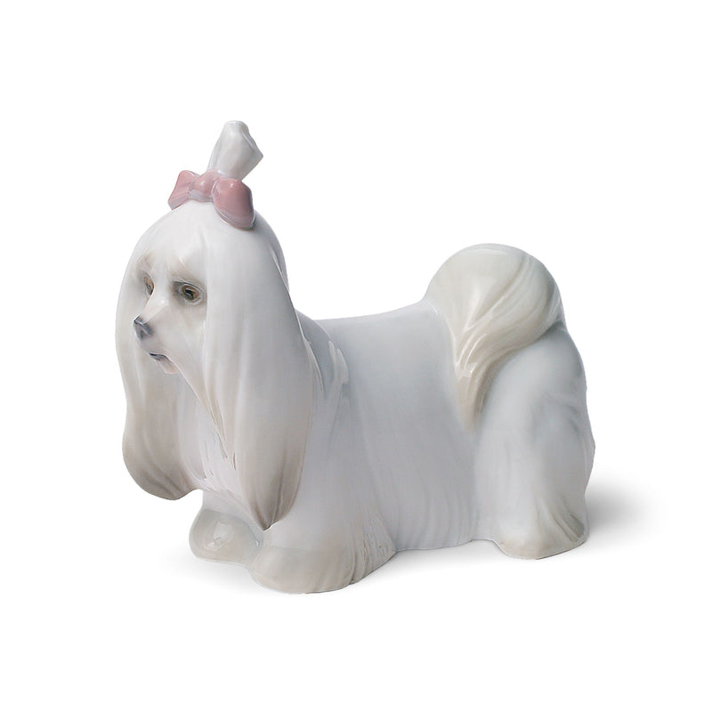 Lladro Maltese porcelain figurine of white dog with pink bow and curled tail