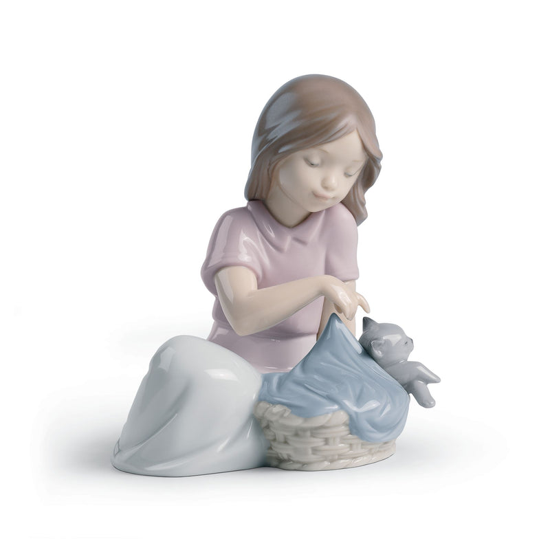 Nao sleeping cat porcelain figurine, girl holding small gray cat on blue blanket