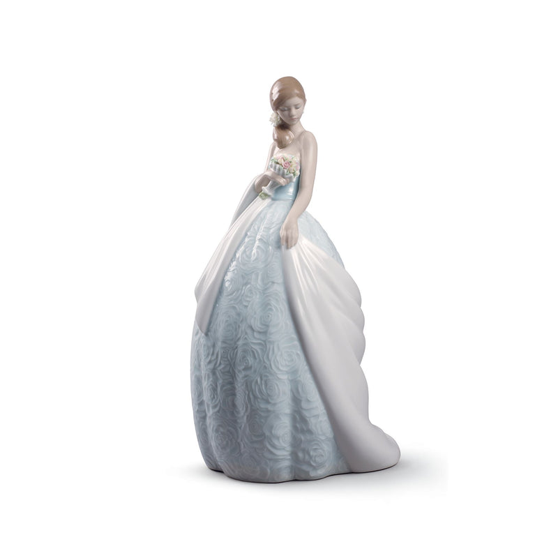 Lladro porcelain figurine of a woman in flowing light blue and white gown holding flowers