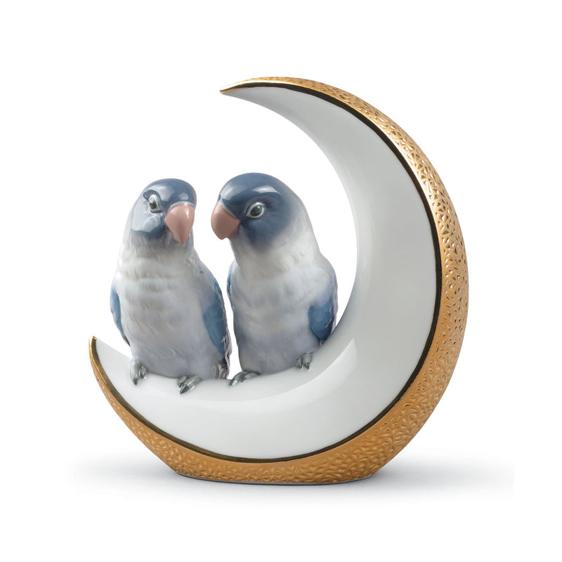 Porcelain figurine of two blue birds on a white gold-trimmed crescent moon
