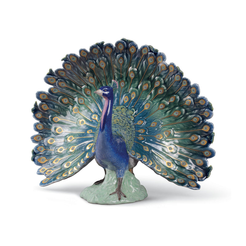 Blue peacock porcelain figurine with detailed fan tail and decorative base
