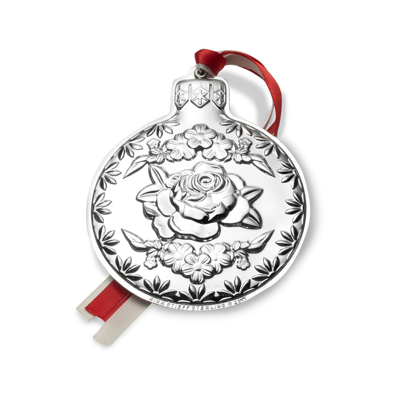 Sterling silver repousse floral ornament with rose relief and red ribbon