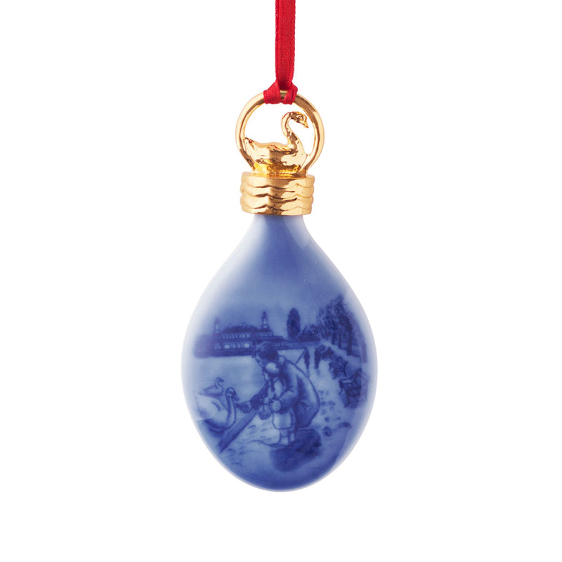 Royal Copenhagen porcelain Christmas drop ornament, blue with gold top and red hanging ribbon