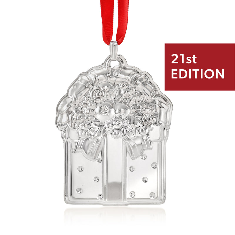 Sterling silver arched ornament with ribbon loop, floral relief details, 21st edition tag