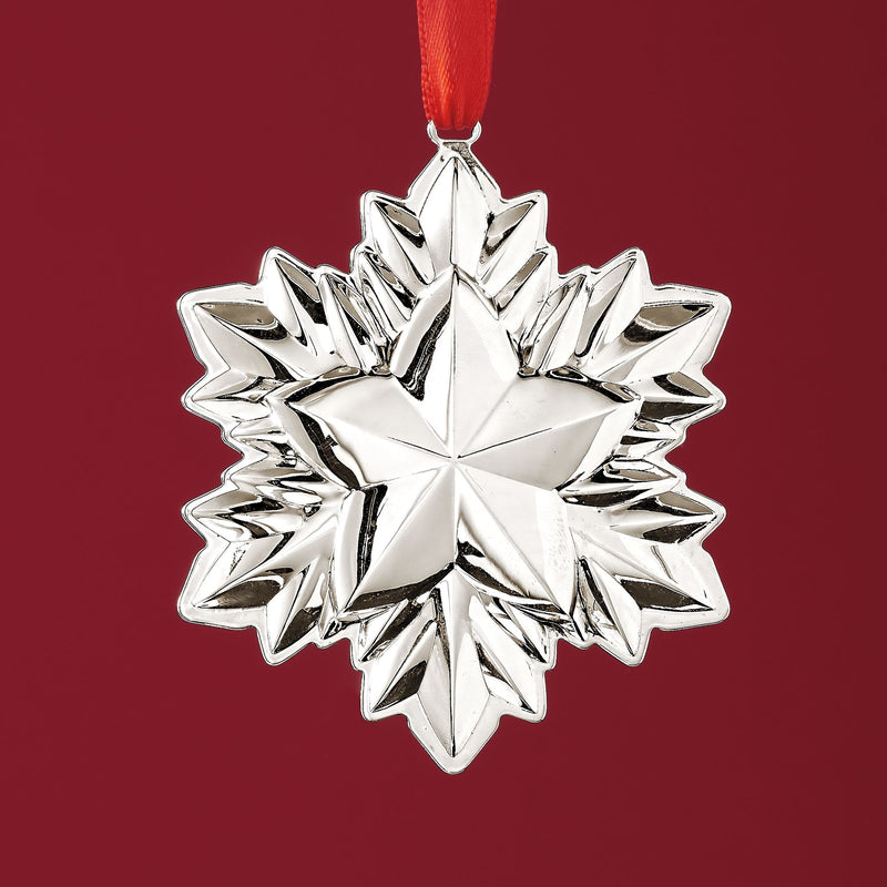 Reed & Barton sterling silver holiday star ornament with hanging red ribbon