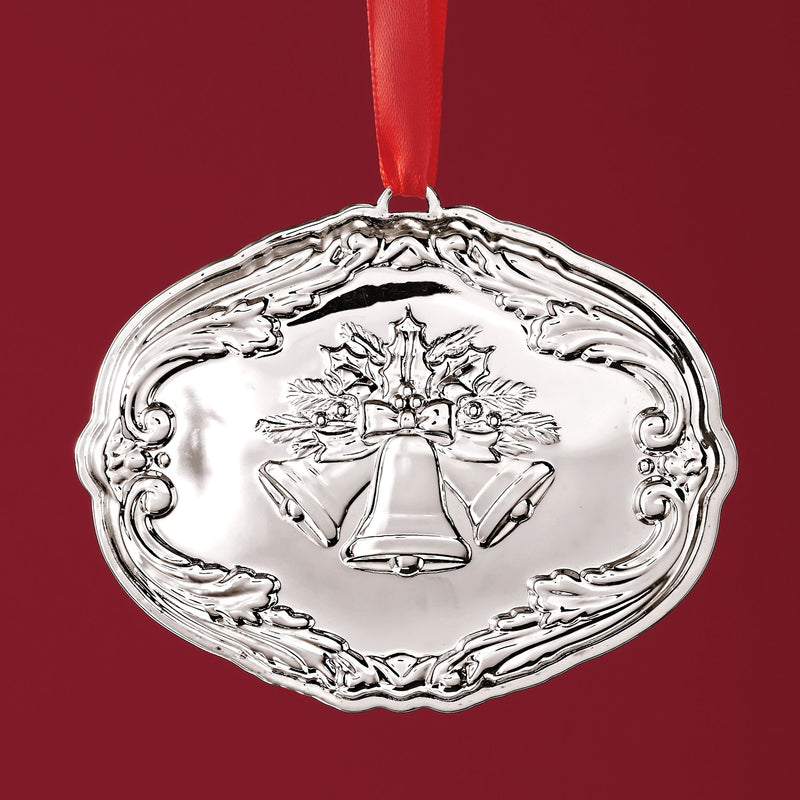 Sterling silver Christmas ornament with holly and bells, round wreath frame, red ribbon