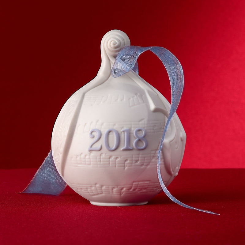 Lladro 2018 porcelain ball ornament with blue ribbon, featuring raised “2018” text