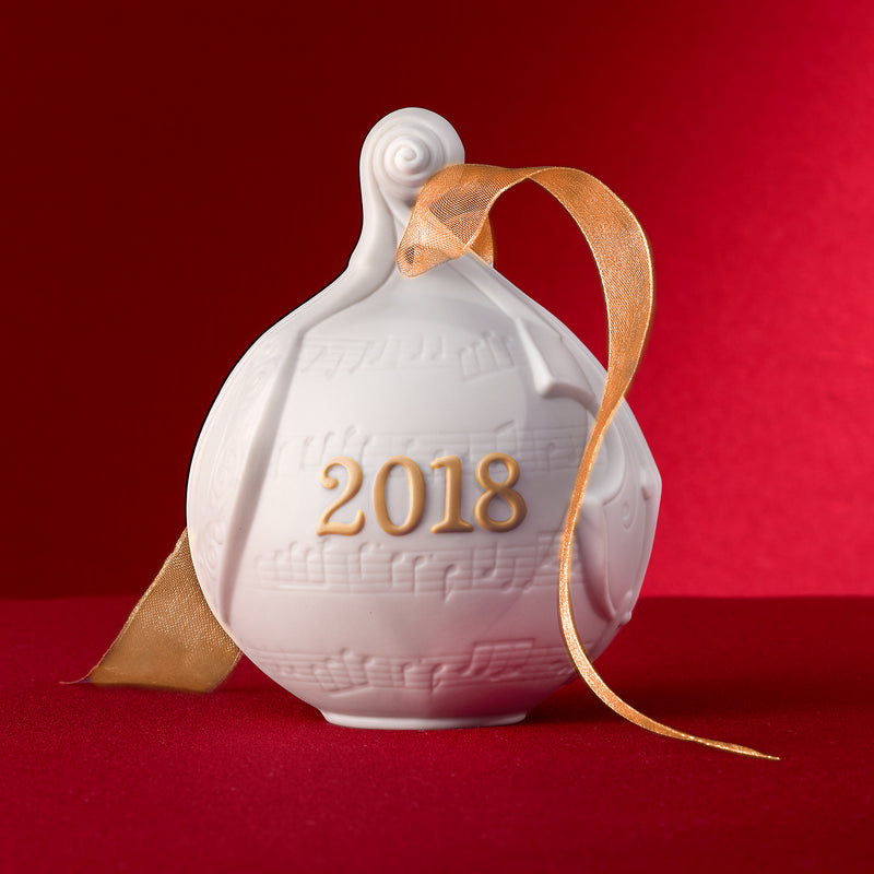 Lladro porcelain ball ornament with gold ribbon and embossed 2018 on white ceramic