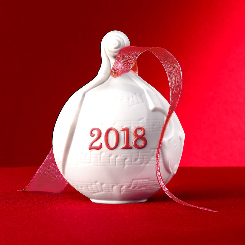 Lladro porcelain ball ornament with red ribbon, embossed '2018' on white globe