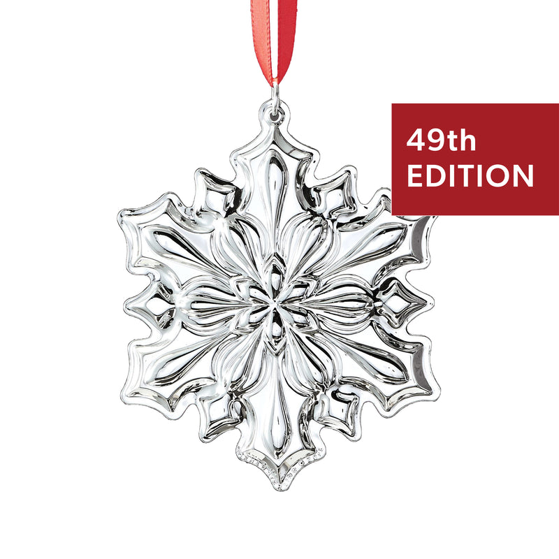 Sterling silver snowflake ornament, 49th edition, with red hanging ribbon loop