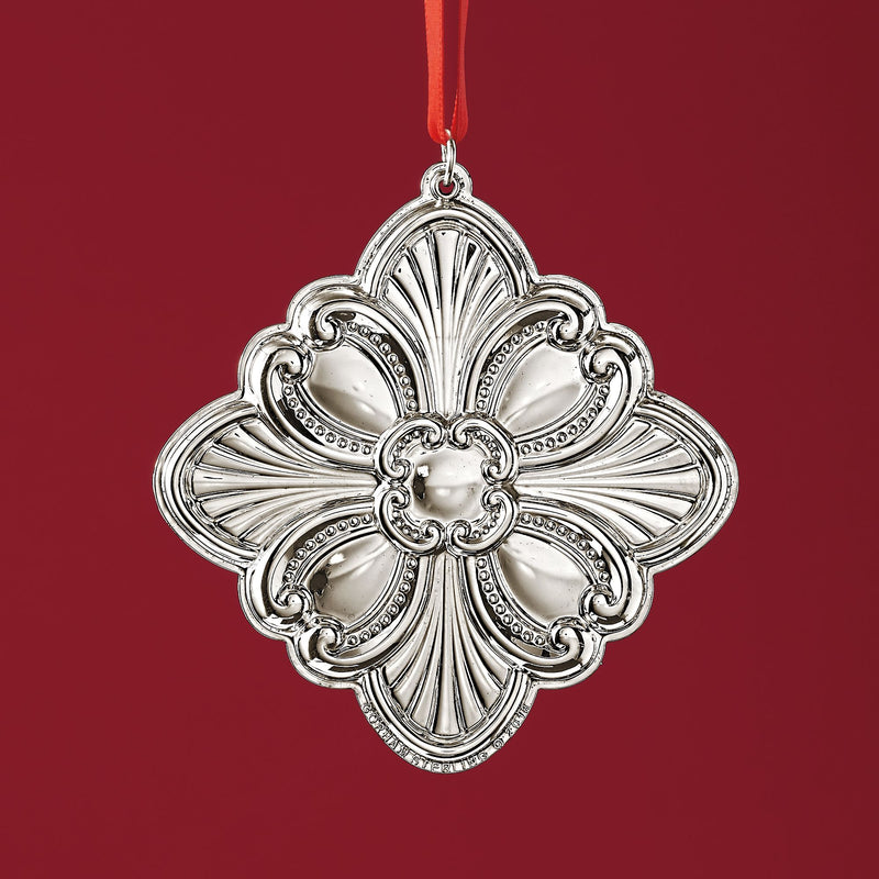 Sterling silver cross ornament with ornate scrollwork and hanging loop