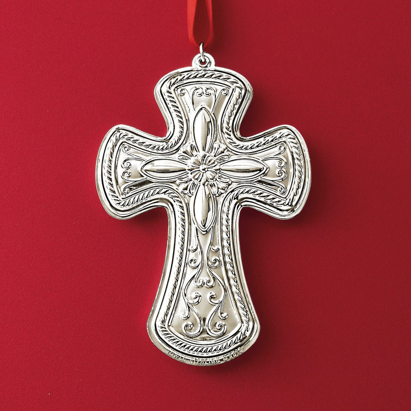 Sterling silver cross ornament with engraved floral center and hanging loop