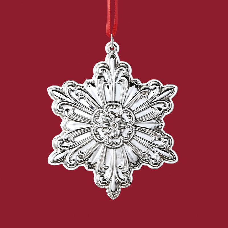 Sterling silver snowflake ornament with ornate floral filigree and hanging loop