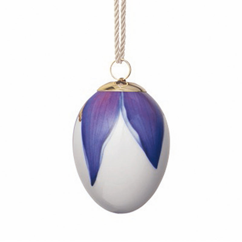 Porcelain Easter egg ornament with blue petal pattern and gold loop