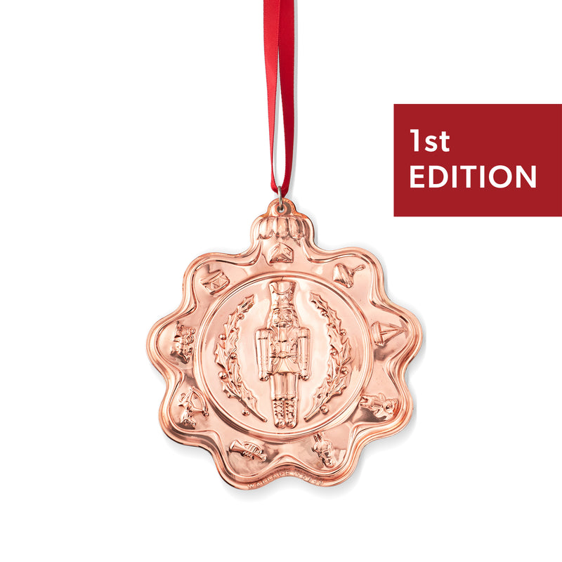 Copper nutcracker ornament with red ribbon, 1st Edition medallion design