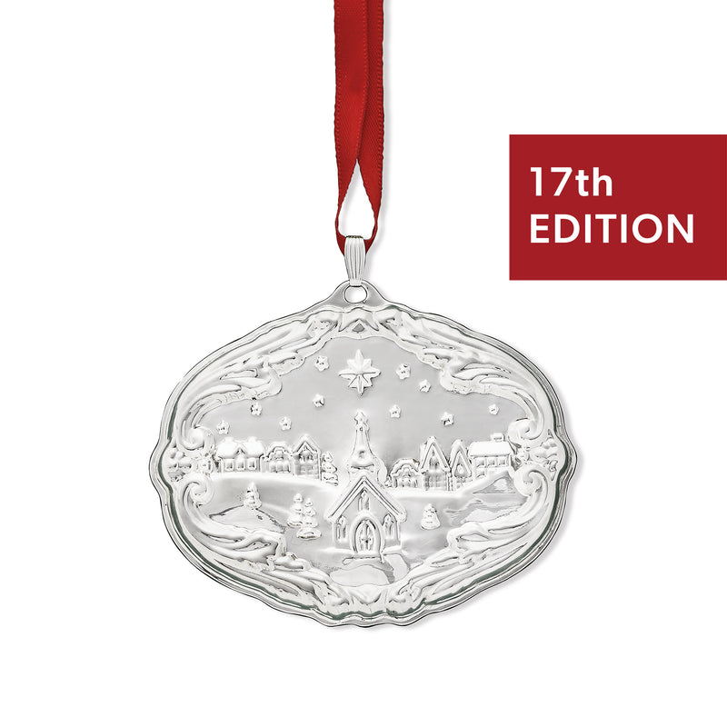 Sterling silver Christmas ornament with oval relief scene and hanging red ribbon, 17th edition