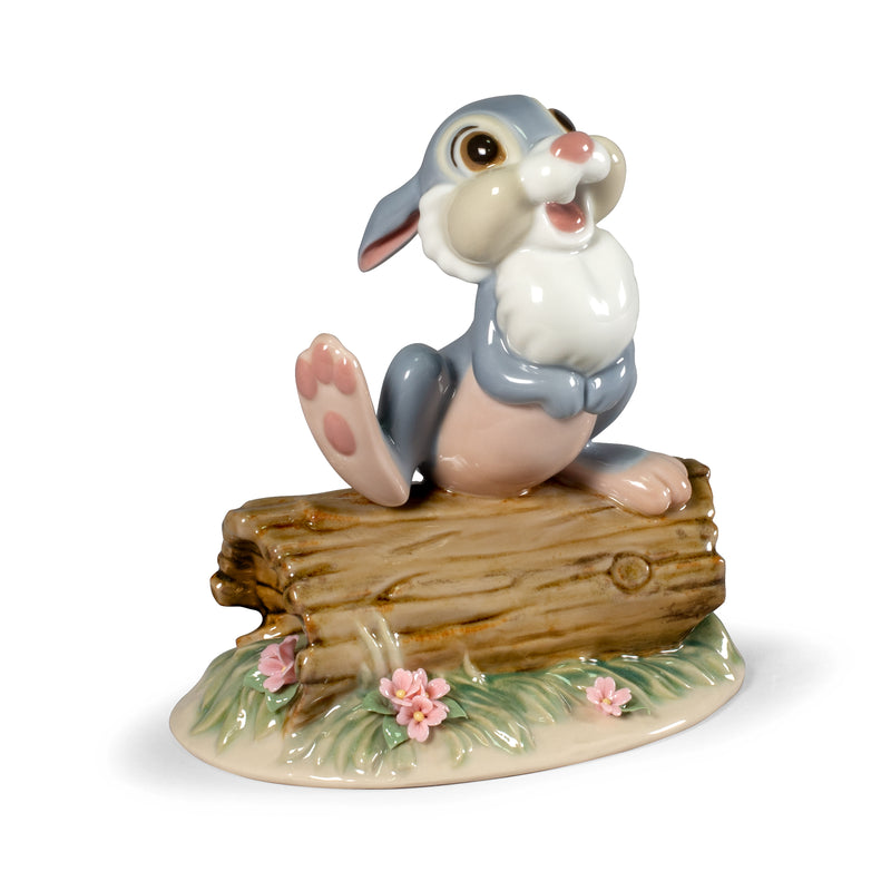 Lladro Thumper porcelain figurine: smiling bunny sitting on log with pink flowers