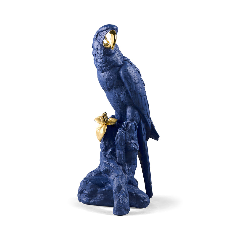 Blue porcelain macaw figurine with gold accents, perched on a base.