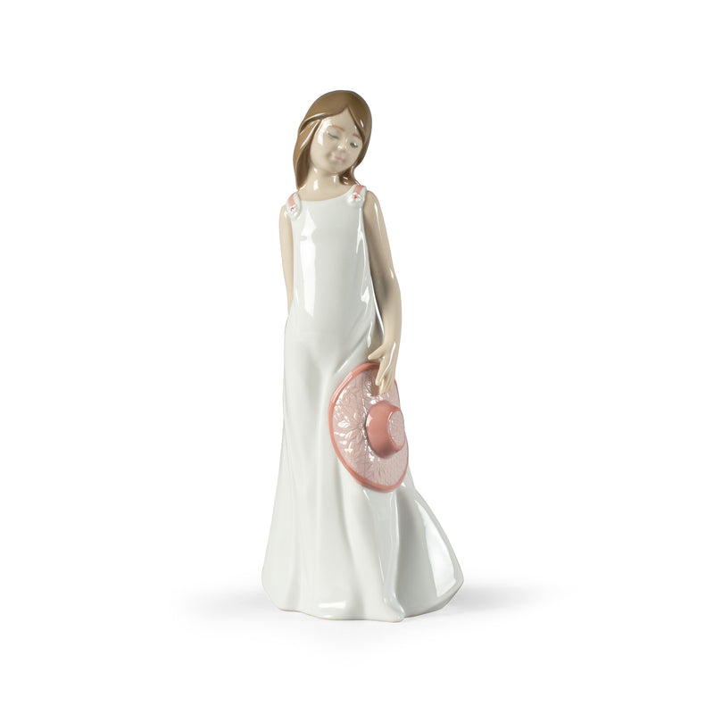 Nao porcelain figurine of a woman in a white dress holding a pink heart