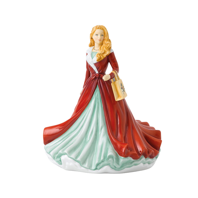 Royal Doulton ceramic figurine of a woman in red and teal dress holding a lantern