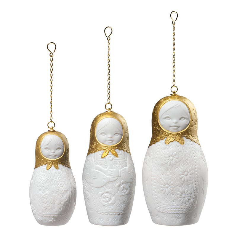 Lladro Russian Winter porcelain nesting doll ornaments, three white dolls with gold chains