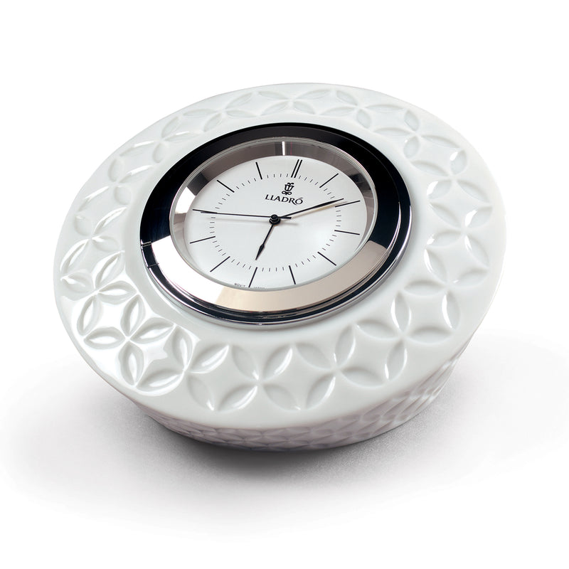 Lladro round porcelain infinite clock with embossed floral pattern and black bezel