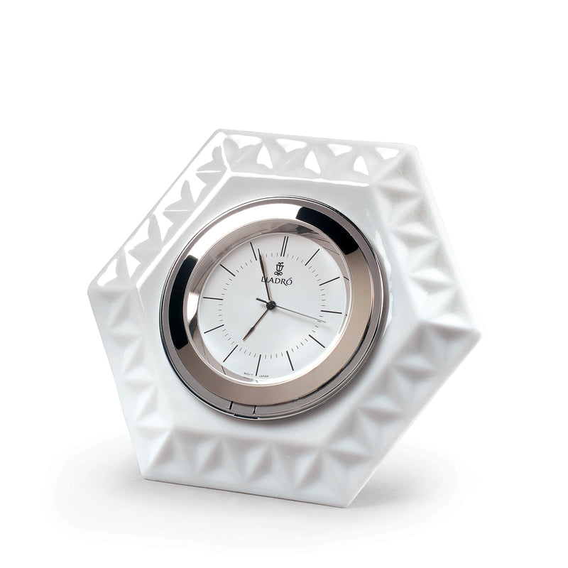 Lladro hexagonal porcelain clock with white dial, chrome bezel, black hands