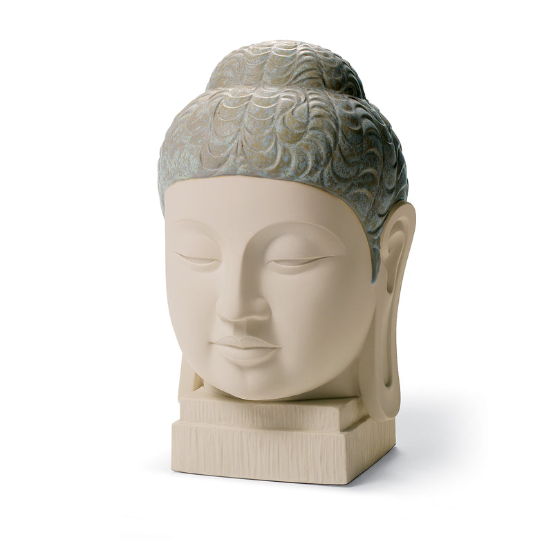 Porcelain Buddha head figurine with blue-green enamel hair and serene face on base