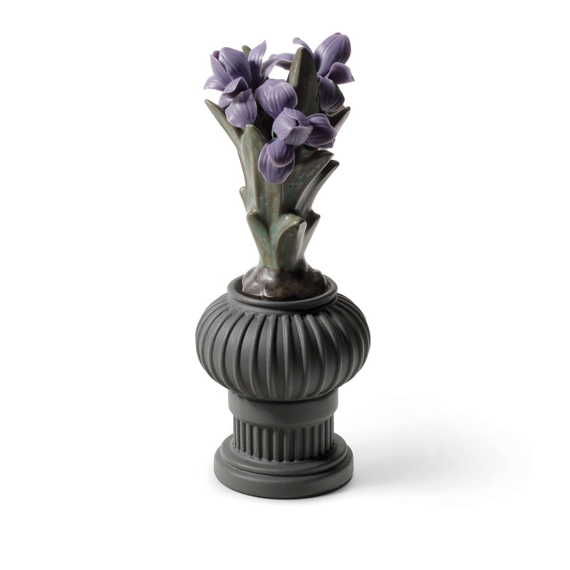 Lladro porcelain flower pot figurine with purple lily blooms on a gray ribbed base