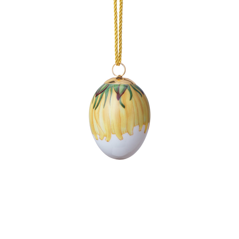 Royal Copenhagen porcelain Easter egg ornament with dandelion petal design, hanging loop