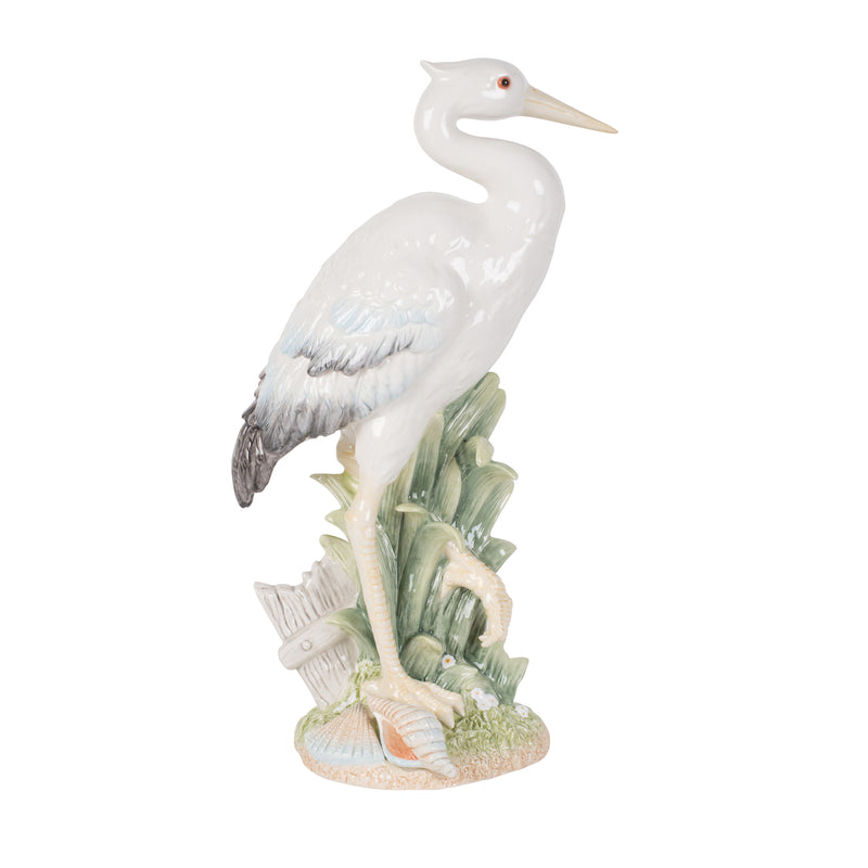 White egret figurine facing forward with shell and seaweed base
